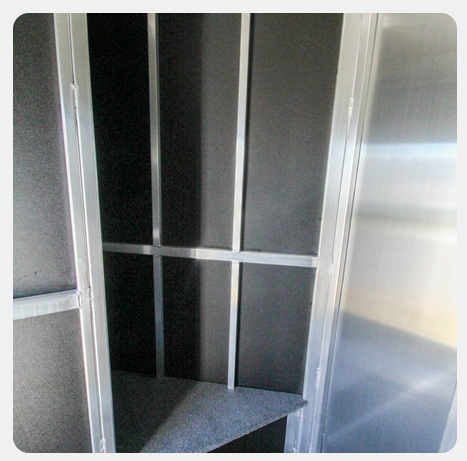 A stainless steel cabinet with a shelf in it