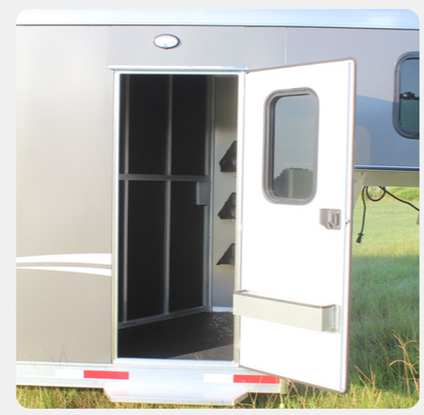 A trailer with the door open and a window