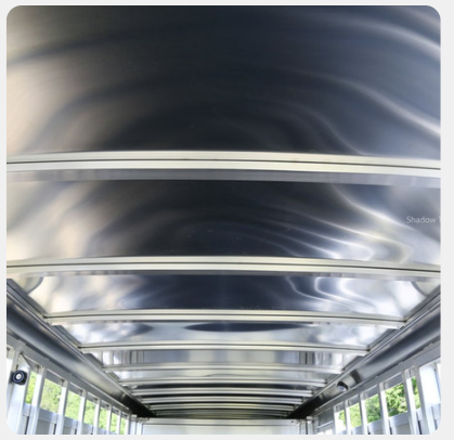 A picture of the inside of a bus showing the ceiling