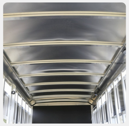 A picture of the inside of a trailer shows the ceiling