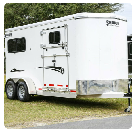 A white trailer with the word shadow on it