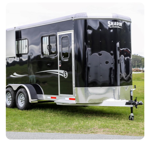 A black trailer with the number 6 on it