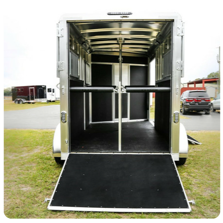 The back of a horse trailer with the door open