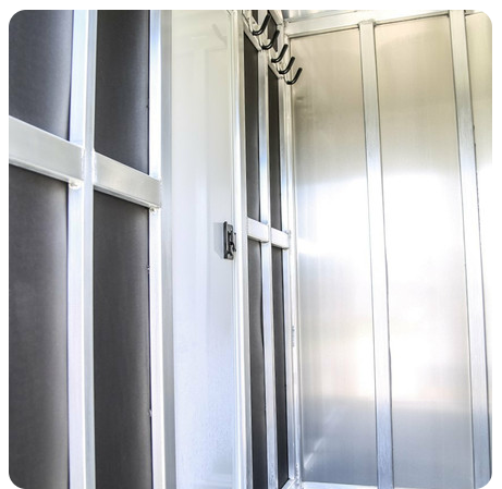 A room with stainless steel walls and doors