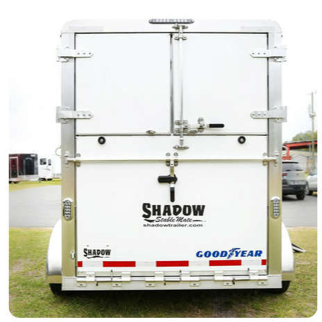 A white trailer with the word shapow on the back