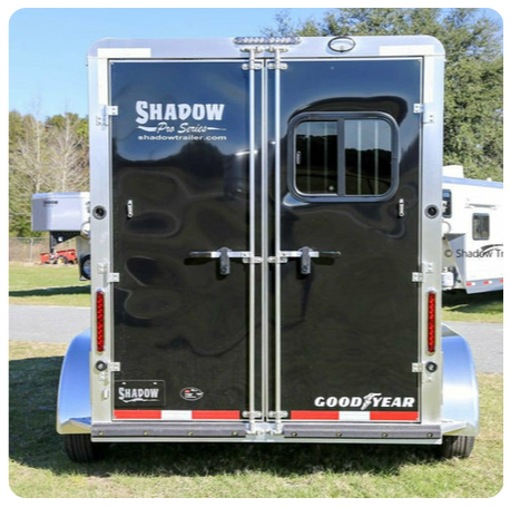 A black trailer with the word shadow on it
