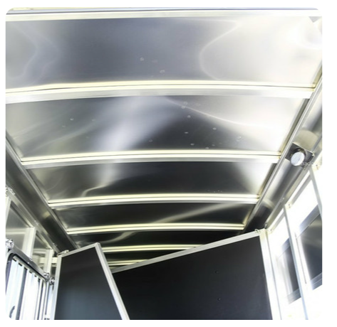 The inside of a trailer with a stainless steel ceiling