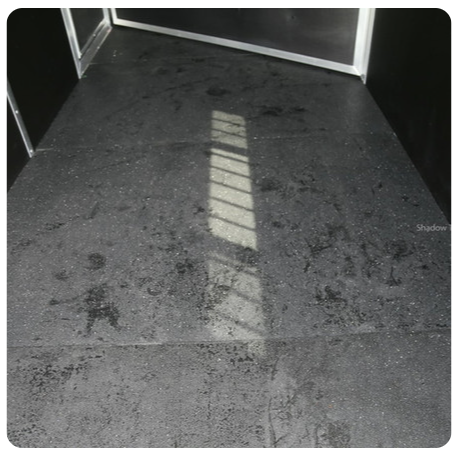 A black and white photo of a dirty floor