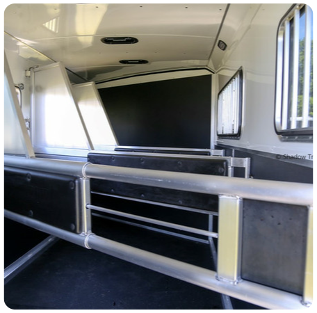 A picture of the inside of a horse trailer.