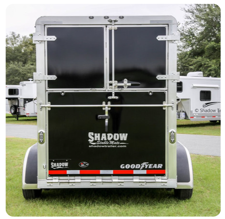 The back of a trailer that says shadow on it
