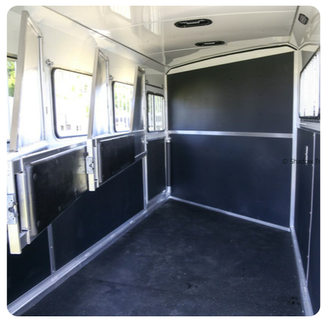 A picture of the inside of a horse trailer
