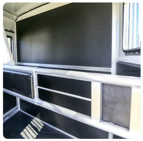 A picture of the inside of a horse trailer