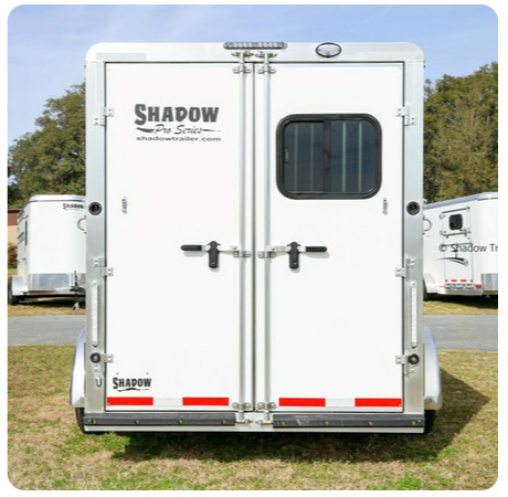 A white trailer with the word shadow on it