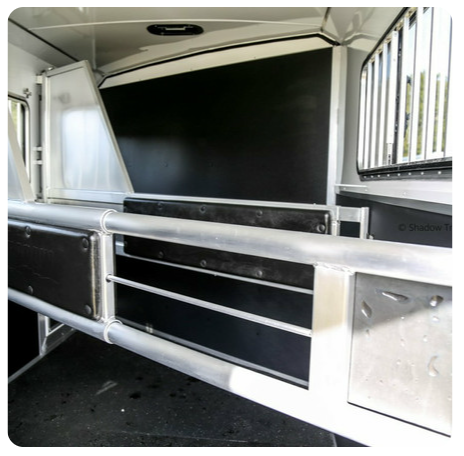 A picture of the inside of a horse trailer