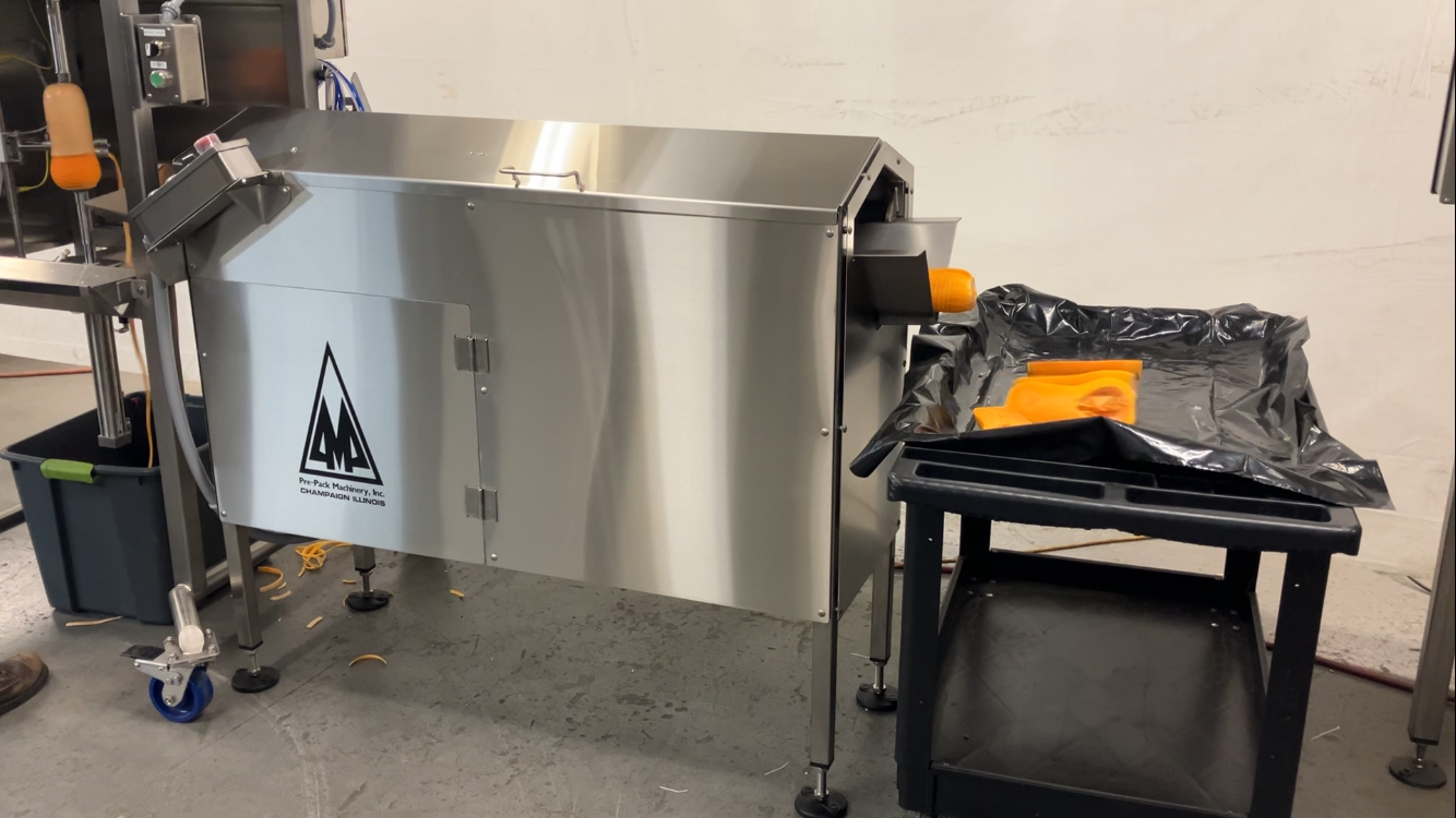 A stainless steel machine with the letter m on it
