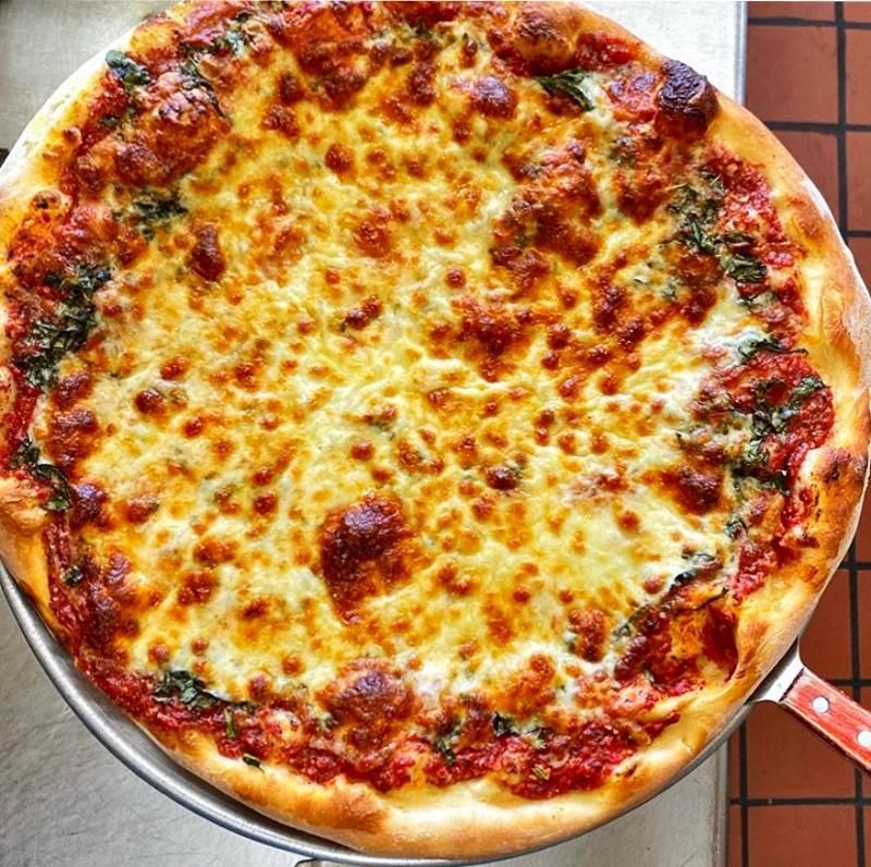 A pizza with a lot of cheese and sauce on it