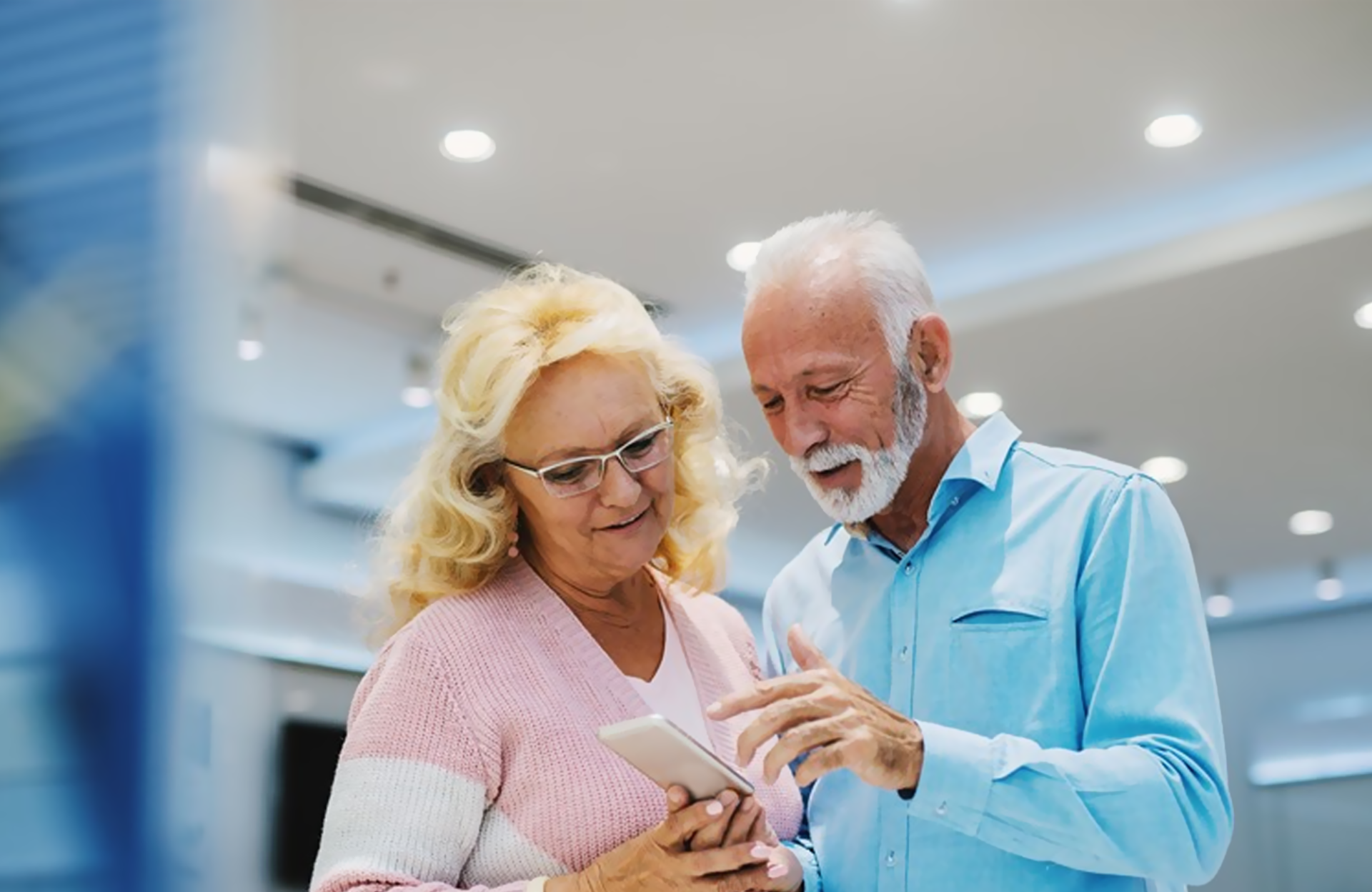 Two couple holding cellphone