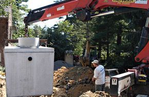 A man working on a septic system installation