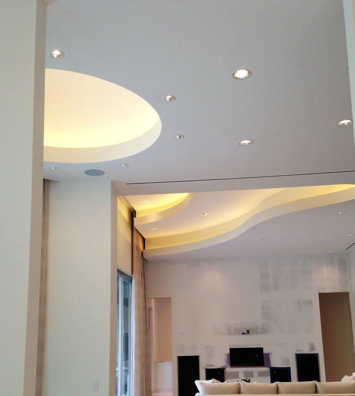 A living room with a curved ceiling and a couch