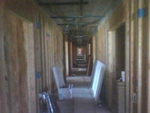 A long hallway in a building under construction