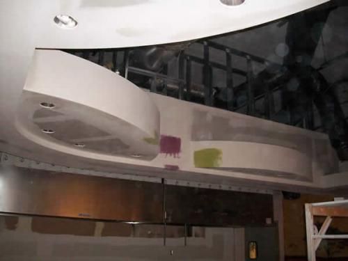 A ceiling with a purple and green circle on it