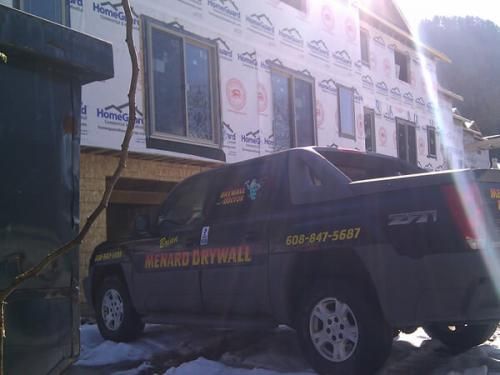 A truck with the word drywall on it