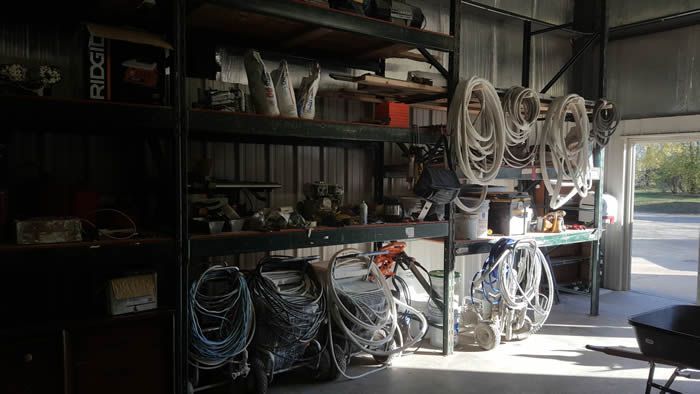 A warehouse filled with lots of tools and ropes.