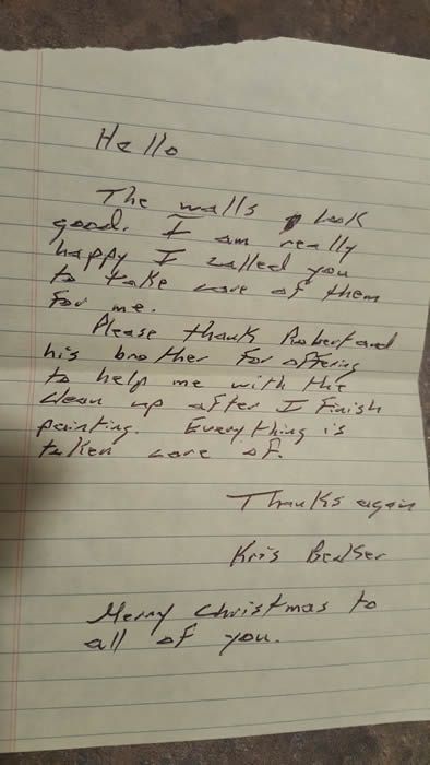 A letter is written in cursive on a piece of paper