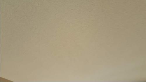 A close up of a white wall with a gray border