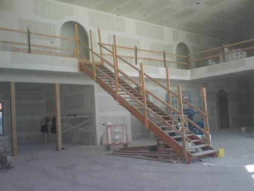 A wooden staircase in a building under construction