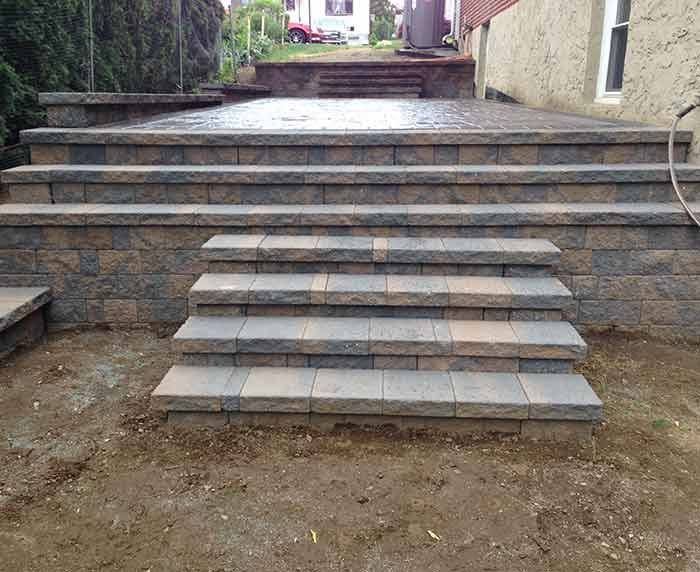 A set of stairs leading up to a patio.
