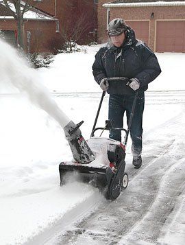 Man using snowblower
