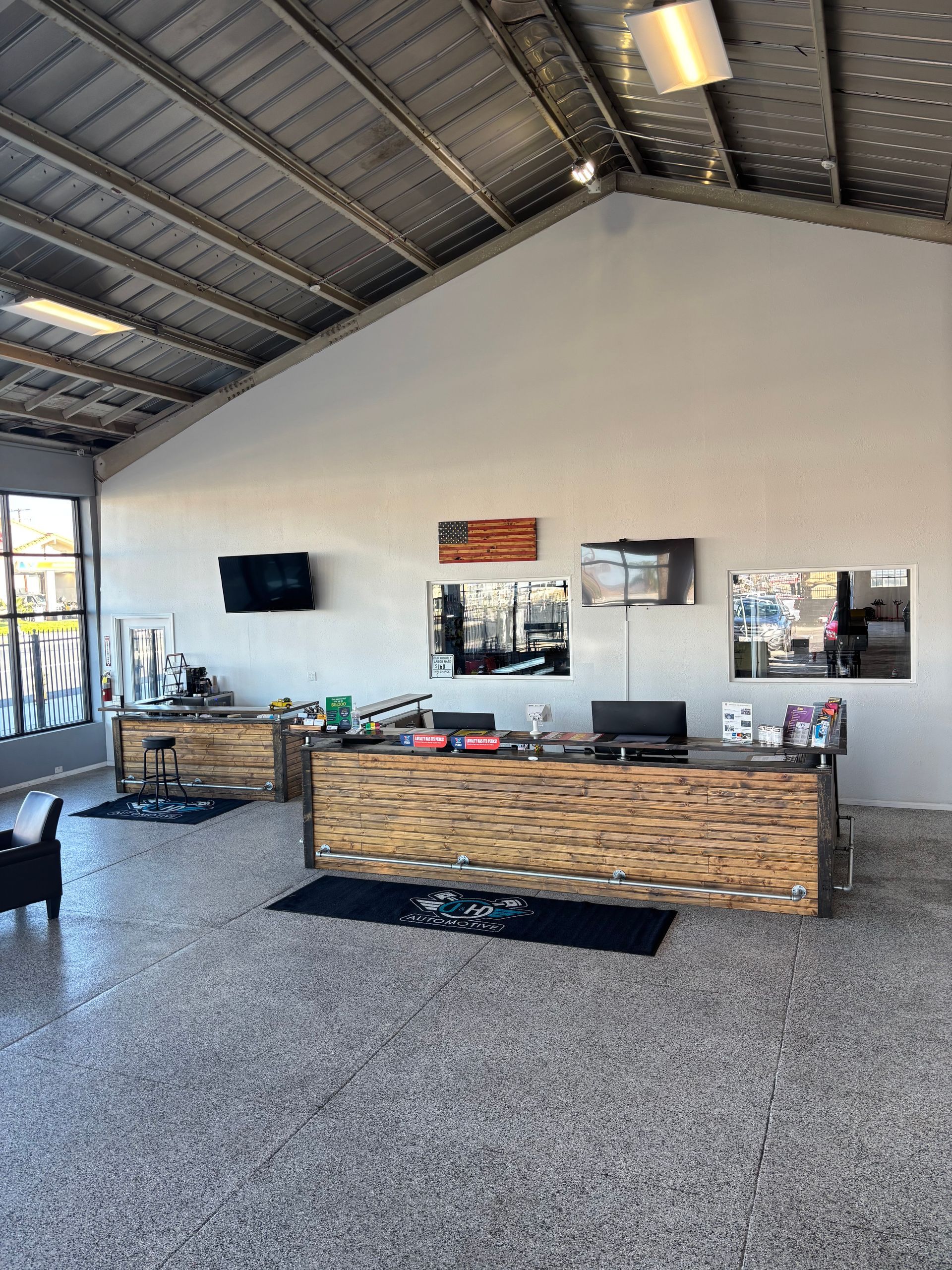 A large room with a wooden counter in the middle of it.