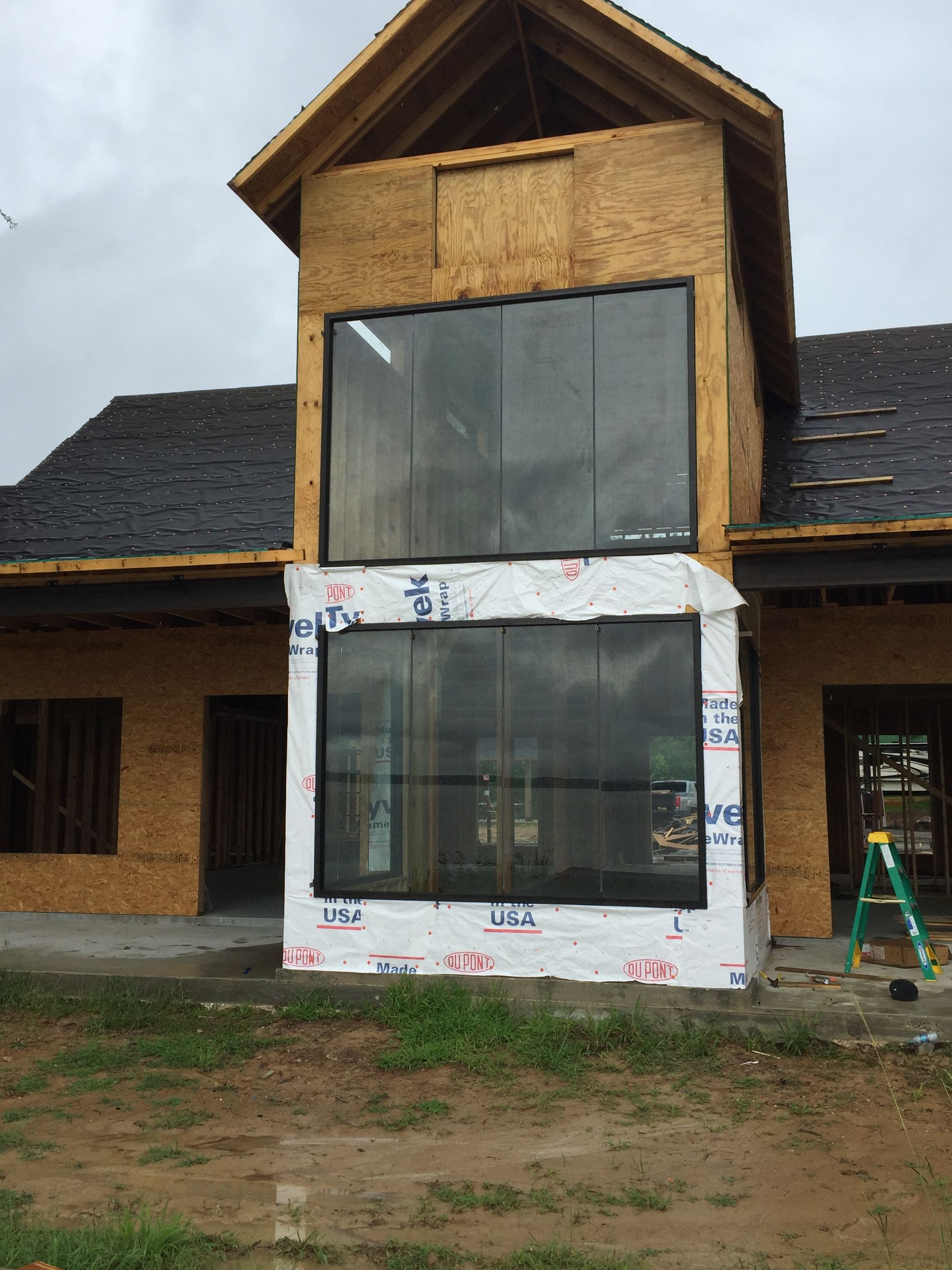 A house with a lot of windows is being built