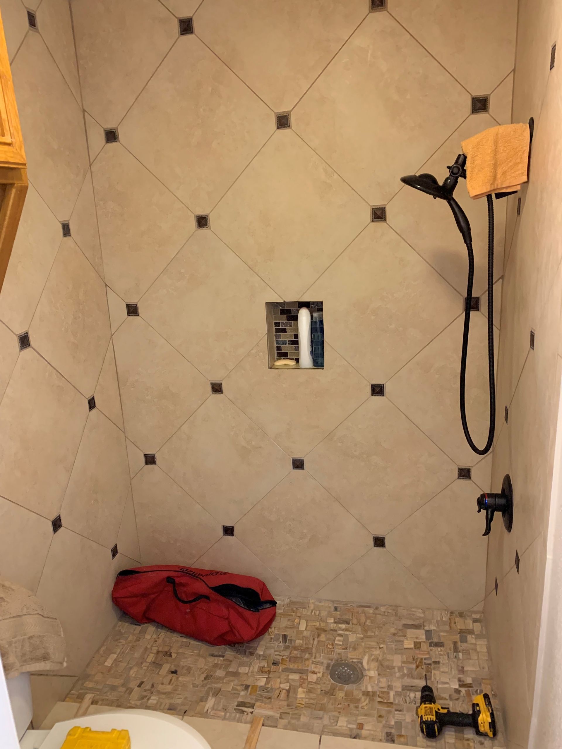 A bathroom with a shower and a toilet