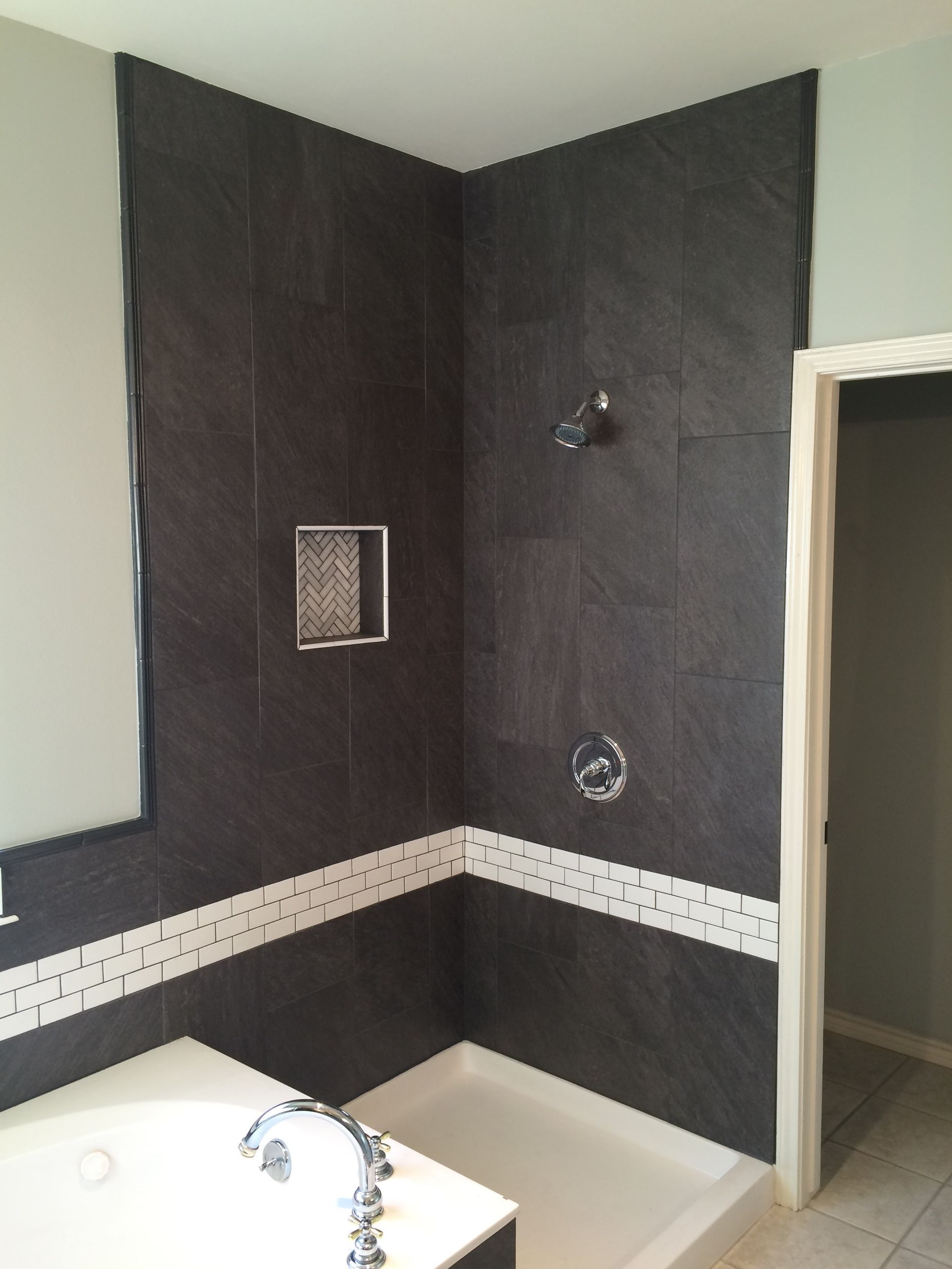 A bathroom with a walk in shower and a bathtub