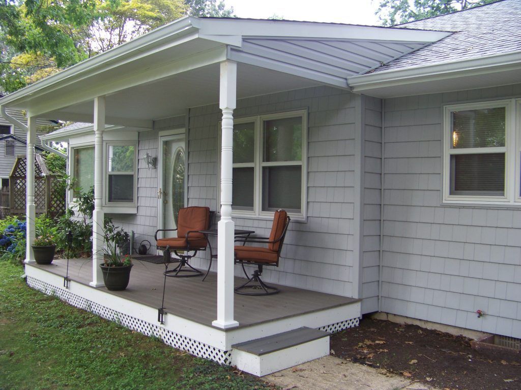 A house with a porch and two chairs
