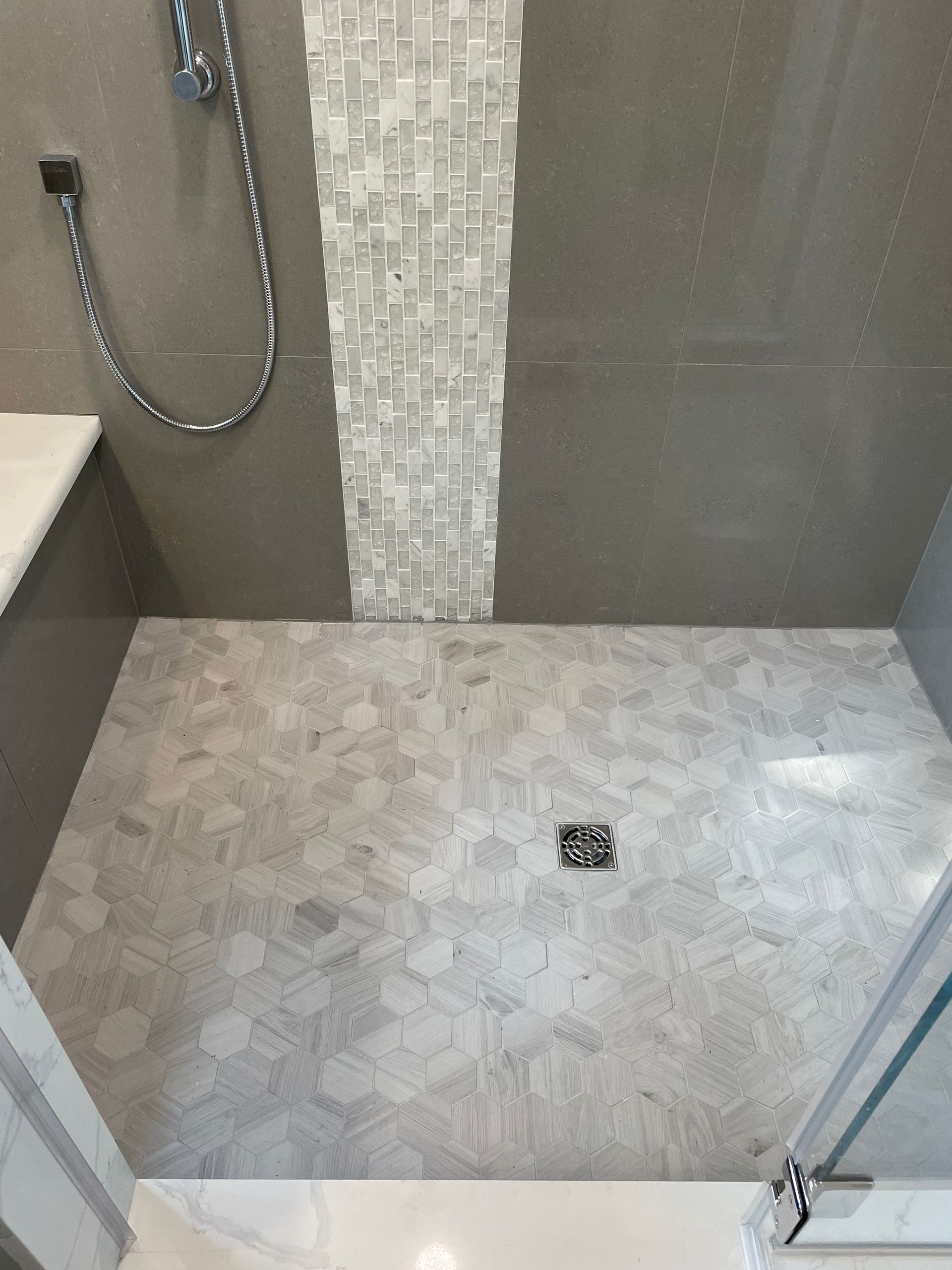 Walk-in shower with different tiles