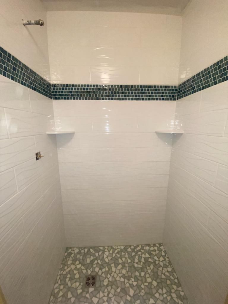 Shower with white tiles