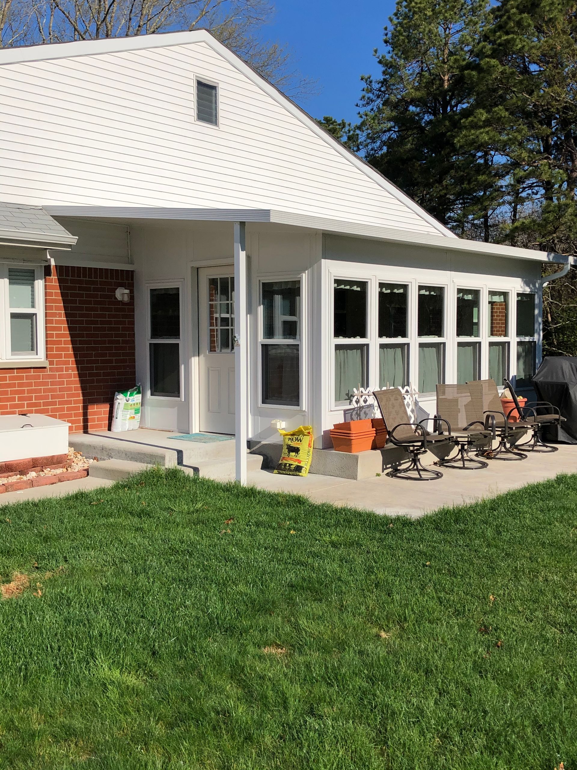A white house with a sunroom