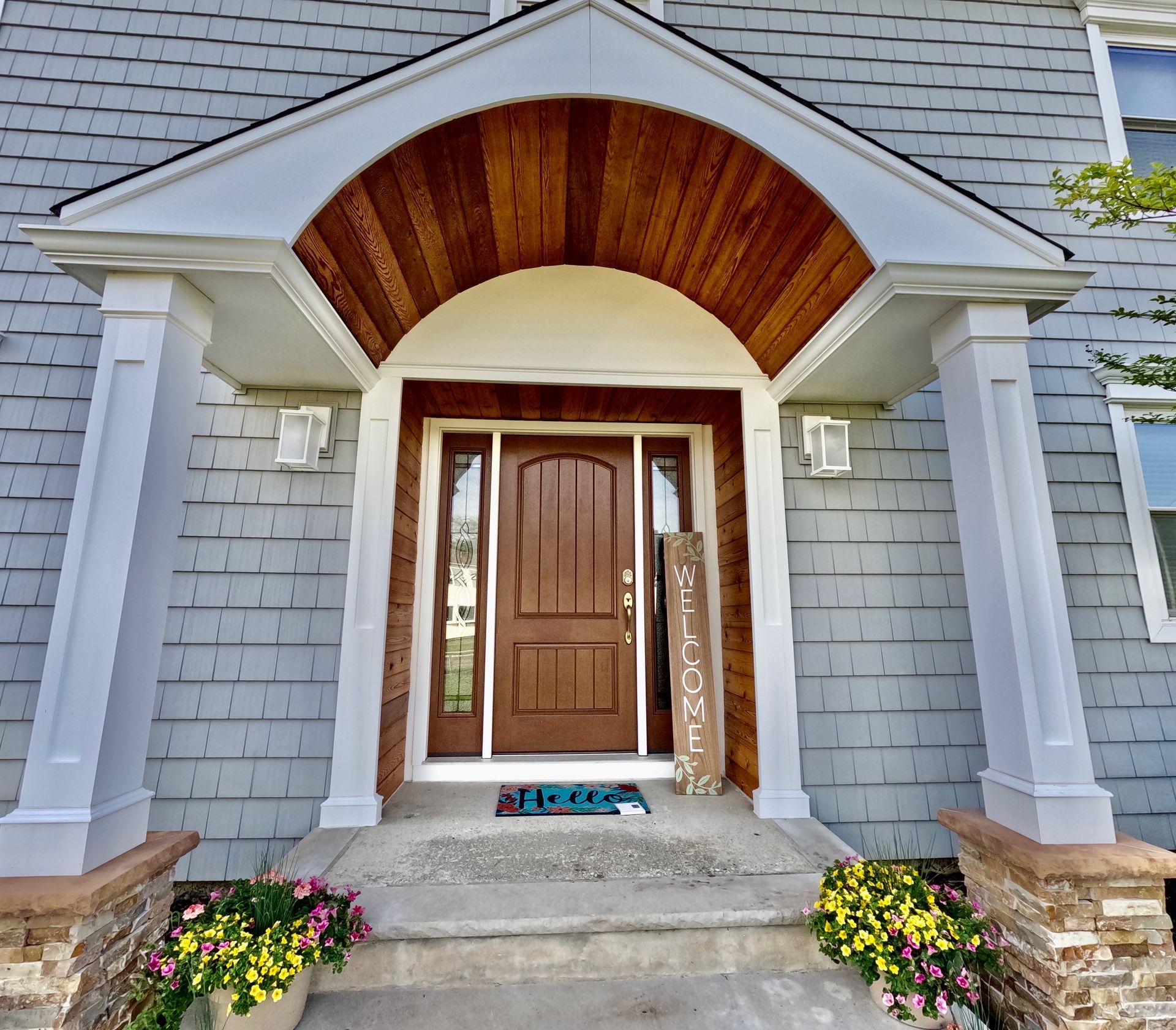 The front door of a house with a welcome sign