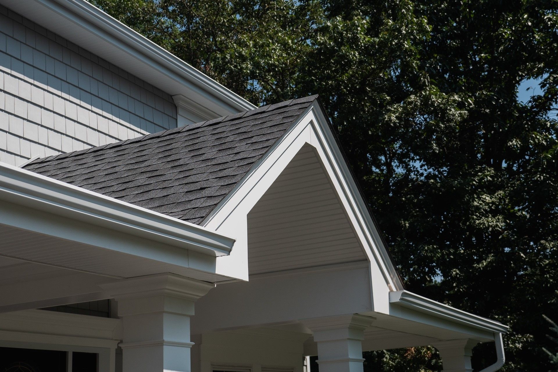 A bathroom with a pedestal sink and a mirror