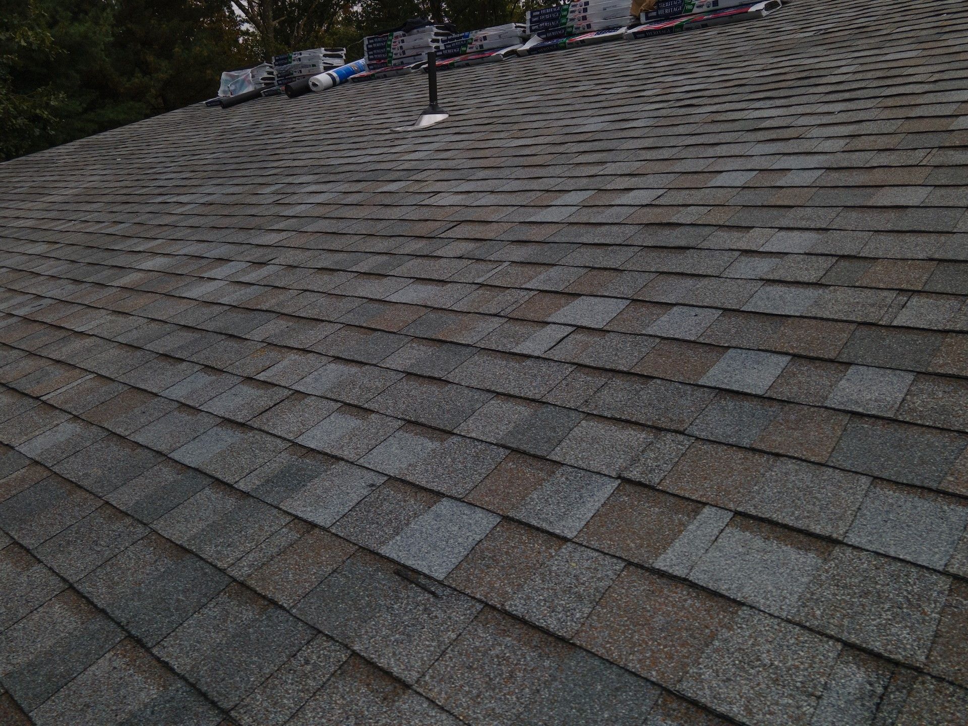 A close up of a roof with shingles on it.