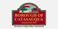Seal of the Borough of Catasauqua, Pennsylvania. Burgundy and green colors. Features buildings and a tree, text reads