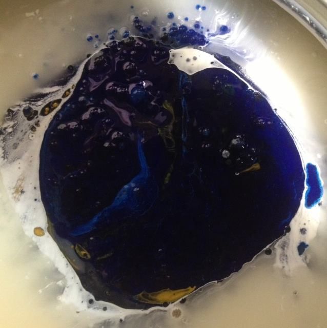 A close up of a blue liquid in a bowl