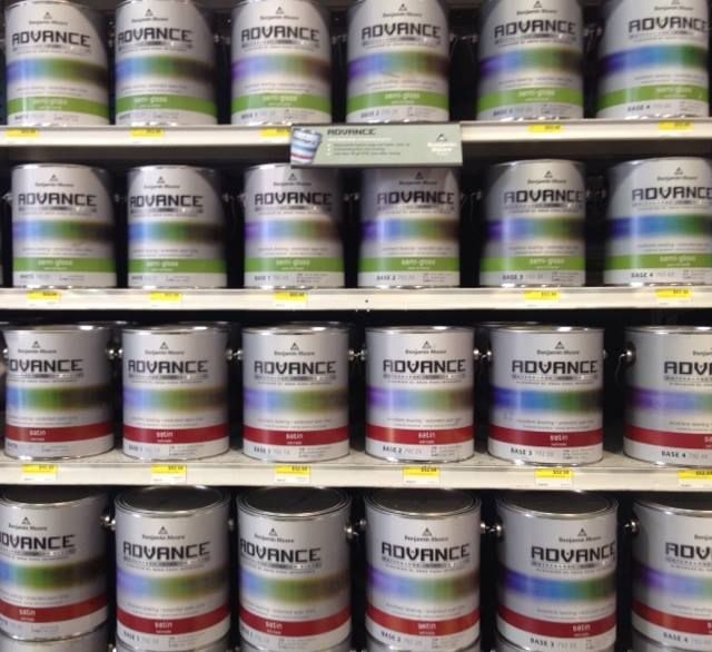 A shelf full of cans of rovance paint