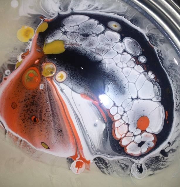 A close up of a colorful painting on a table