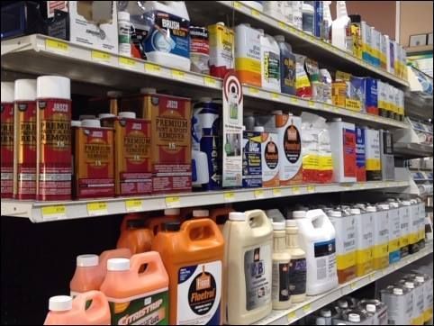 A store shelf filled with lots of different types of chemicals