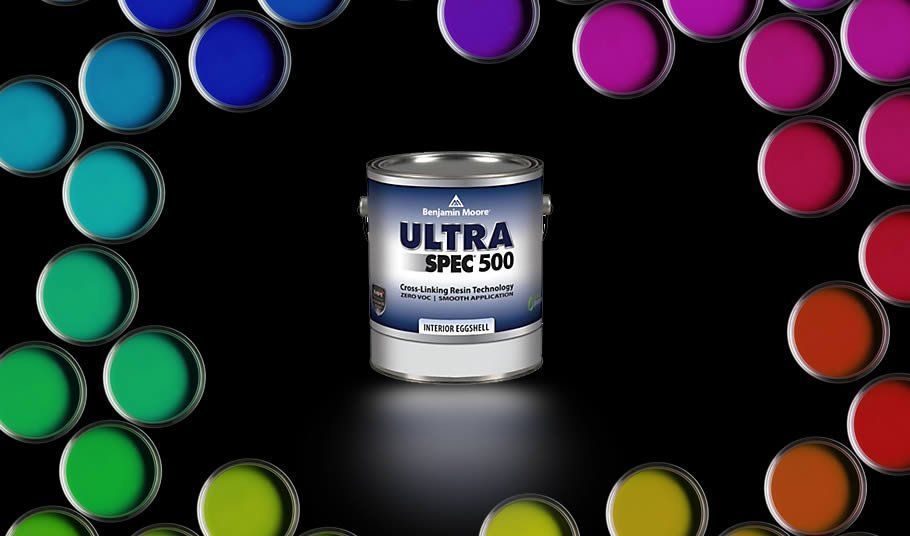 A can of ultra spec 500 paint is surrounded by many different colors