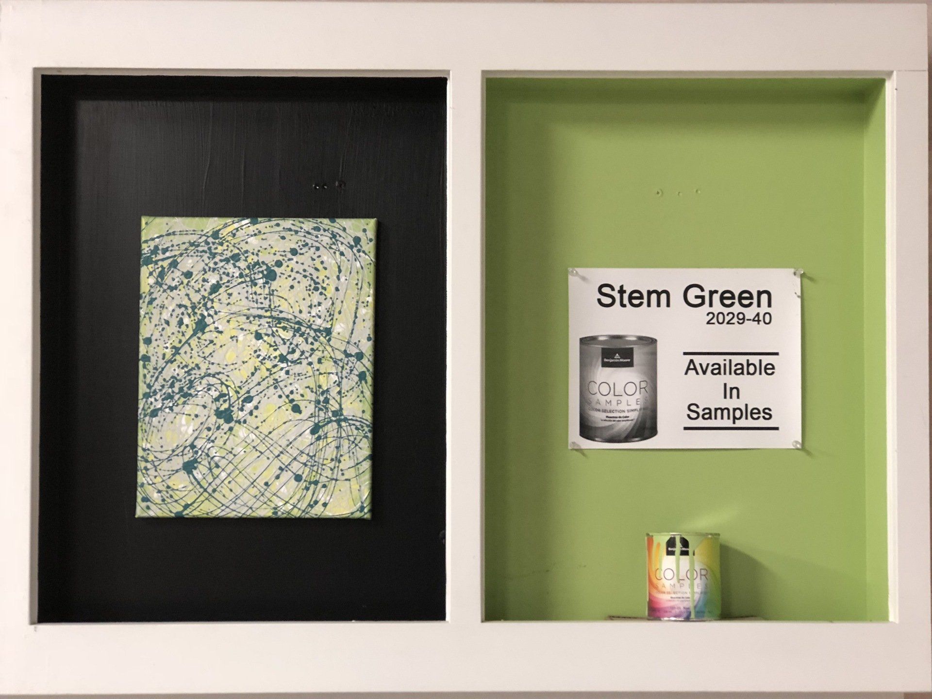A picture of a painting and a sign that says stem green